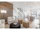 Spacious open-concept living space showcases a modern staircase and seamless flow between living and dining areas at 2920 W Parkside Pl, Denver, CO 80221