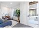 Bright living area featuring a large window, modern furnishings, and stylish decor at 2920 W Parkside Pl, Denver, CO 80221