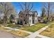 This charming home boasts mature trees and a well-manicured front yard, creating great curb appeal at 1002 Detroit St, Denver, CO 80206