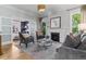 Elegant living room with a fireplace, plush seating, and an inviting atmosphere at 1002 Detroit St, Denver, CO 80206