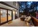 Outdoor deck with comfortable seating and a grill, perfect for relaxing and entertaining at 1935 Poncha Ct, Larkspur, CO 80118