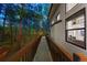 Exterior deck offering scenic views of the surrounding forest and natural landscape at 1935 Poncha Ct, Larkspur, CO 80118