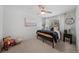 Bright bedroom with neutral carpet, large window, and ceiling fan for added comfort at 1935 Poncha Ct, Larkspur, CO 80118
