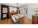 Elegant dining room with a wooden table, seating for six, and stylish decor at 1935 Poncha Ct, Larkspur, CO 80118