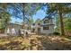 Beautiful two-story home featuring a modern design and situated in a serene wooded setting at 1935 Poncha Ct, Larkspur, CO 80118