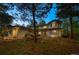 Charming home with a well-maintained front yard, mature trees, and inviting entrance at 1935 Poncha Ct, Larkspur, CO 80118
