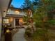Charming front entrance with a welcoming walkway and a cozy porch seating area at 1935 Poncha Ct, Larkspur, CO 80118