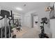 Home gym equipped with various exercise machines and weights for a complete workout at 1935 Poncha Ct, Larkspur, CO 80118