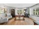Light-filled home office with hardwood floors, large windows and custom built-in cabinets at 1935 Poncha Ct, Larkspur, CO 80118