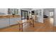 Bright kitchen with white cabinetry, granite counters, and stainless appliances at 1935 Poncha Ct, Larkspur, CO 80118