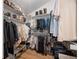 Walk-in closet with custom shelving and ample storage for shoes and clothing at 1935 Poncha Ct, Larkspur, CO 80118