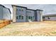 Modern two-story home with gray siding, large windows, and a spacious backyard at 23708 E 42Nd Ave, Aurora, CO 80019