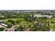 Scenic aerial view of a lush park with a lake, walking trails, and beautiful green spaces at 8455 W Belmar Ave, Lakewood, CO 80226