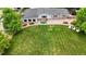Beautifully landscaped backyard with lush green grass, outdoor seating, and a serene setting at 8455 W Belmar Ave, Lakewood, CO 80226
