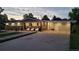 Charming exterior of a well-maintained home with a spacious driveway and landscaped front yard at 8455 W Belmar Ave, Lakewood, CO 80226