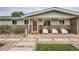 Inviting front entrance with modern chairs, decorative landscaping, and a well-maintained walkway at 8455 W Belmar Ave, Lakewood, CO 80226