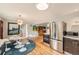 Bright and modern kitchen with stainless steel appliances, stylish decor, and an eat-in area at 8455 W Belmar Ave, Lakewood, CO 80226