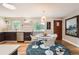 Bright eat-in kitchen featuring modern appliances, stylish decor, and hardwood floors at 8455 W Belmar Ave, Lakewood, CO 80226