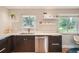 Modern kitchen featuring stainless steel appliances, sleek cabinets, and an open layout at 8455 W Belmar Ave, Lakewood, CO 80226