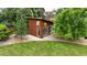 Cozy backyard studio interior features a spacious desk, ample storage, and natural light from large windows at 8455 W Belmar Ave, Lakewood, CO 80226