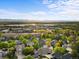 Beautiful aerial view of the community with manicured lawns and mature trees at 7411 S Crescent Ct, Littleton, CO 80120