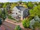 Aerial view of home with deck, fenced yard, garden, mature trees and backyard landscaping at 7411 S Crescent Ct, Littleton, CO 80120