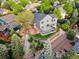 Backyard with multi-level deck, and stone steps leading to a beautifully landscaped garden at 7411 S Crescent Ct, Littleton, CO 80120