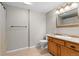 Bathroom with wood vanity and tiled floors at 7411 S Crescent Ct, Littleton, CO 80120