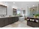 Bright bathroom with a soaking tub, walk-in shower, dual vanity sinks, and plenty of towel storage at 7411 S Crescent Ct, Littleton, CO 80120