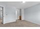 This carpeted bedroom provides dual access to a private bathroom at 7411 S Crescent Ct, Littleton, CO 80120