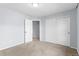 Bedroom with neutral colored walls, carpeted floors, and a closet at 7411 S Crescent Ct, Littleton, CO 80120