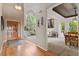 Open-concept layout with views of the foyer, living room, and dining area with great natural light at 7411 S Crescent Ct, Littleton, CO 80120