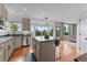 Bright kitchen with a center island, stainless steel appliances, and an open layout with scenic views at 7411 S Crescent Ct, Littleton, CO 80120