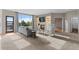 Cozy living room with fireplace, comfortable seating, and scenic views through a glass patio door at 7411 S Crescent Ct, Littleton, CO 80120