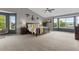 Expansive main bedroom features large windows with scenic views, a king-size bed, and tasteful decor at 7411 S Crescent Ct, Littleton, CO 80120