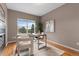 Cozy office space with a fireplace, a large window with views, and comfortable seating for a productive work environment at 7411 S Crescent Ct, Littleton, CO 80120