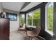 Sitting area with two chairs, a table, and a large window view of the outdoors at 7411 S Crescent Ct, Littleton, CO 80120