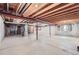 Unfinished basement space with exposed ceiling, concrete floors and walls, offering potential for customization at 2288 S Depew St, Lakewood, CO 80227