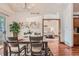 Elegant dining room with stylish table set, natural light, and access to the bedroom at 2288 S Depew St, Lakewood, CO 80227