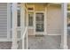 Inviting entryway with security screen door and a convenient porch area, enhancing the home's curb appeal at 2288 S Depew St, Lakewood, CO 80227