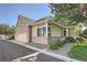Charming home exterior with well-maintained landscaping, brick accents, and attached garage at 2288 S Depew St, Lakewood, CO 80227