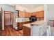 Well-organized kitchen with wooden cabinets, and stainless steel appliances at 2288 S Depew St, Lakewood, CO 80227