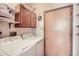 Practical laundry room with washer, dryer, storage cabinets and ample counter space at 2288 S Depew St, Lakewood, CO 80227