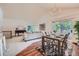 Bright living room with vaulted ceilings, modern chandelier, open floor plan and sliding glass door at 2288 S Depew St, Lakewood, CO 80227