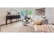 Comfortable living room with large windows, modern decor, and a cozy seating arrangement at 2288 S Depew St, Lakewood, CO 80227