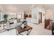 Spacious living area with open layout, neutral tones, and seamless flow to dining and kitchen areas at 2288 S Depew St, Lakewood, CO 80227