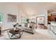 Open-concept living space with modern furnishings, adjacent dining area, and a view of the bedroom at 2288 S Depew St, Lakewood, CO 80227