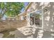 Private patio features a brick wall and sliding glass doors, perfect for outdoor dining and relaxation at 2288 S Depew St, Lakewood, CO 80227