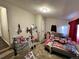 Bedroom with full bed and various items on the floor at 11856 E 7Th Ave, Aurora, CO 80010