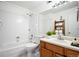 Well-maintained bathroom featuring a bathtub, vanity, and essential fixtures at 3335 S Ammons St # 6-102, Lakewood, CO 80227